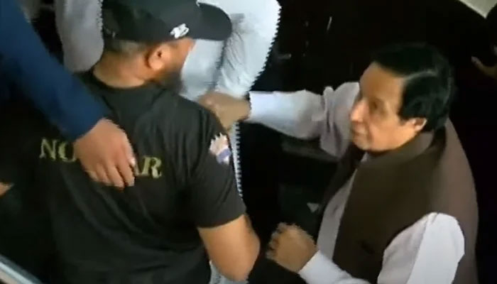 Parvez Elahi is being escorted to the anti-corruption court by guards on June 2, 2023, in this still taken from a video. — YouTube/GeoNews