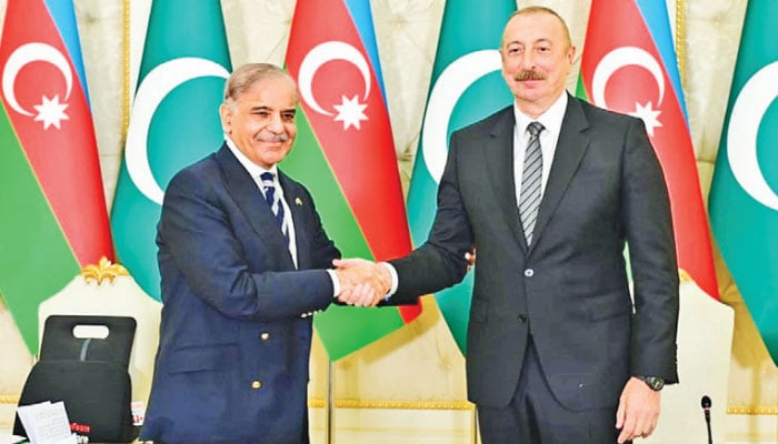 Prime Minister Shehbaz Sharif and President of Azerbaijan Ilham Aliyev shake hands during a joint press stakeout at Zugulba Palace, Thursday.—The News