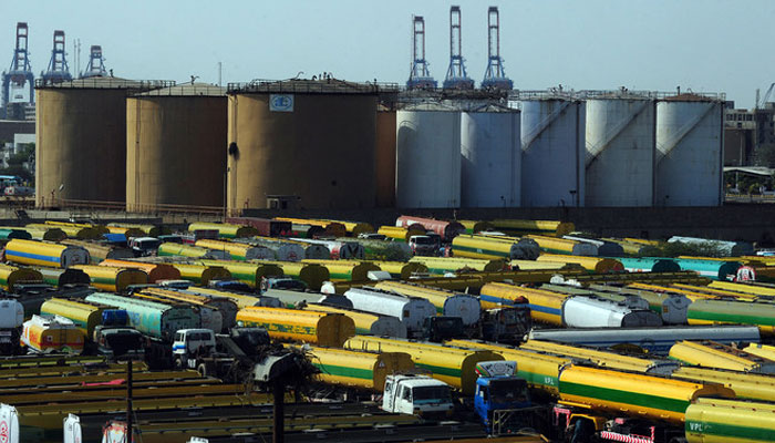 An overview shows tankers parked outside a local oil refinery in the Pakistans port city of Karachi, Pakistan, on February 22, 2011. (AFP/File)