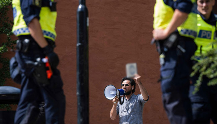 Salwan Momika prepares to desecrate the Muslim holy book Quran, outside a mosque in Stockholm, Sweden, June 28, 2023. —AFP