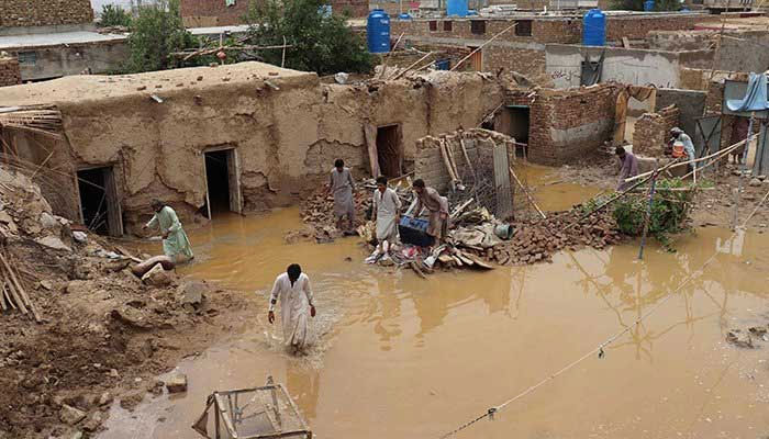 Residents clear debris of a damaged house due to a heavy monsoon rainfall on the outskirts of Quetta on July 5, 2022. — AFP/file