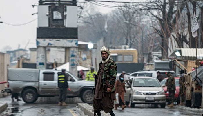A member of the Taliban security force stands guard on a blocked road after a suicide blast near Afghanistans foreign ministry at the Zanbaq Square in Kabul on Jan.11, 2023. — AFP