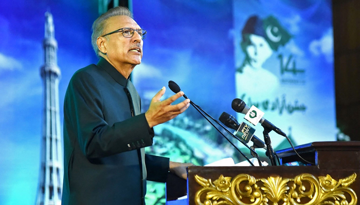 This photograph taken on August 14, 2023, shows President Arif Alvi speaking during a flag hoisting ceremony to commemorate Independence Day celebrations in Islamabad. — PID