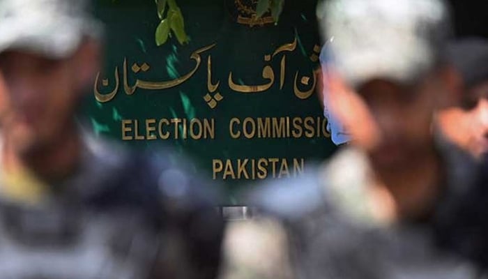 Paramilitary soldiers stand guard outside Pakistans election commission building in Islamabad on August 2, 2022. — AFP
