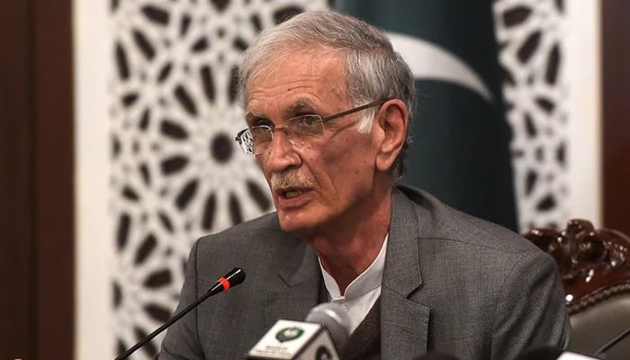 Former Defense Minister Pervez Khattak addresses a press conference in Islamabad. — AFP/File