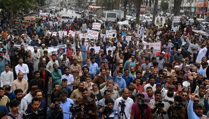 Traders shout slogans during a protest at a street in Karachi, August 23, 2023, against the surge in petrol and electricity prices as Pakistan endures soaring inflation. — AFP