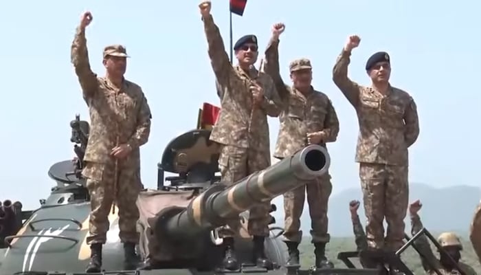 In this still taken from a video released by Pakistan Armys media wing shows Chief of Army Staff (COAS) General Syed Asim Munir (c) surrounded by senior army officers while visiting the Tilla Field Firing Ranges near Jhelum on August 30, 2023. — YouTube/ISPR Official