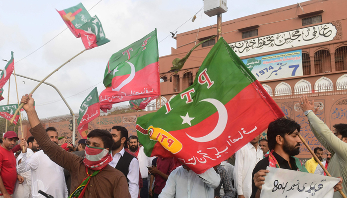 Pakistan Tehreek-e-Insaf (PTI) party activists and supporters protest against the arrest of former PM Imran Khan, in Karachi on August 27, 2023. — AFP