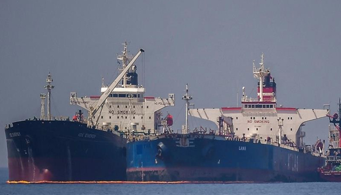 The Liberian-flagged oil tanker Ice Energy (L) transfers crude oil from the Russian-flagged oil tanker Lana (R) (former Pegas ), off the shore of Karystos, on the Island of Evia, May 29, 2022. — AFP