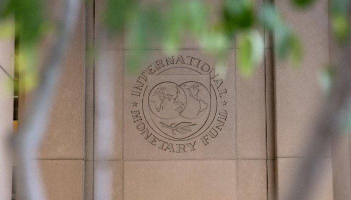 The International Monetary Fund (IMF) logo is displayed outside its headquarters in Washington, DC, on Oct 8, 2022. — AFP
