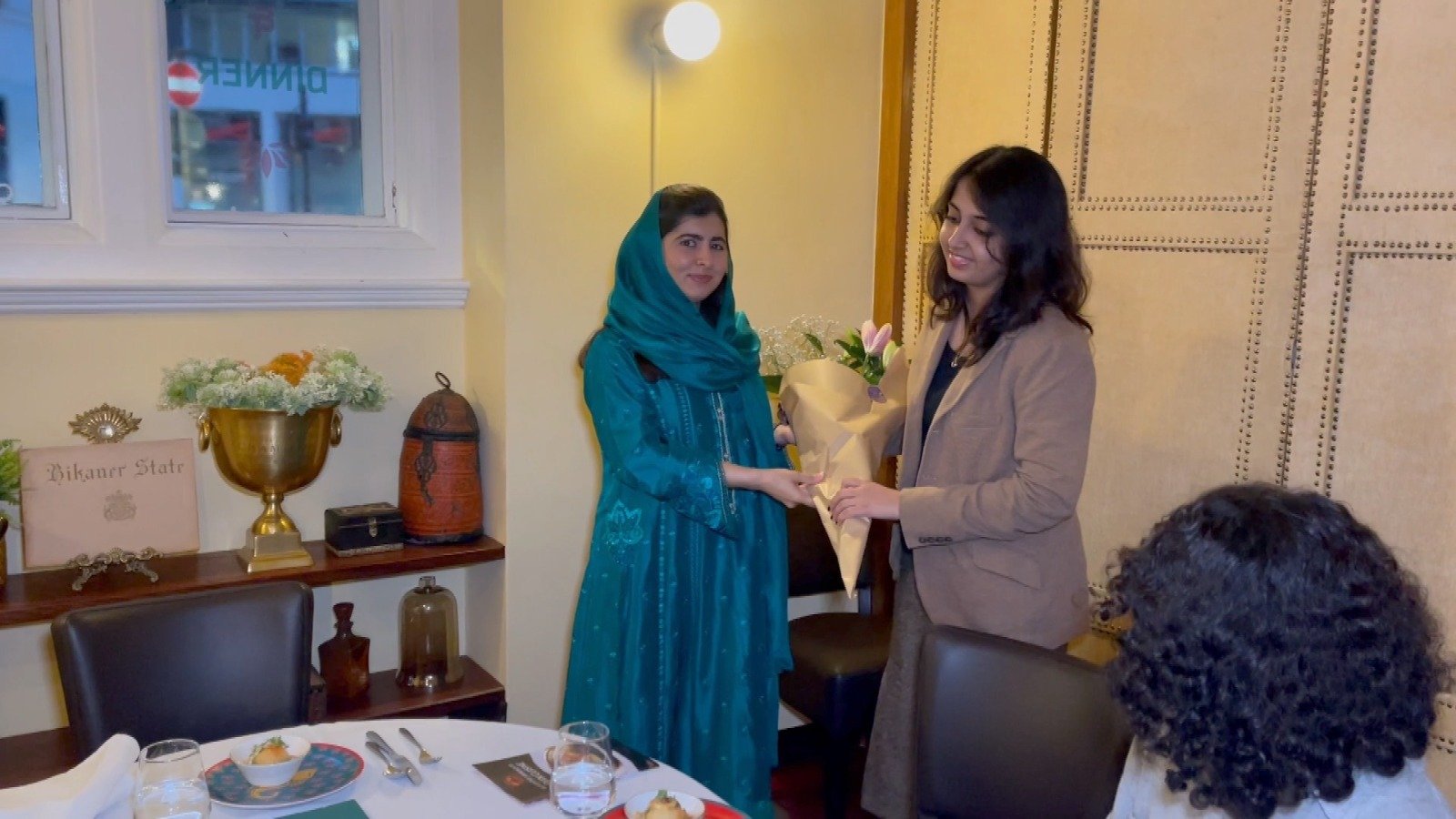 Nobel Peace Prize winner and education activist Malala Yousafzai (left) while presenting a bouquet to  the Pakistani Mahnoor Cheema who passed 34 GCSEs with A-stars, making a new UK and world record. — By the author