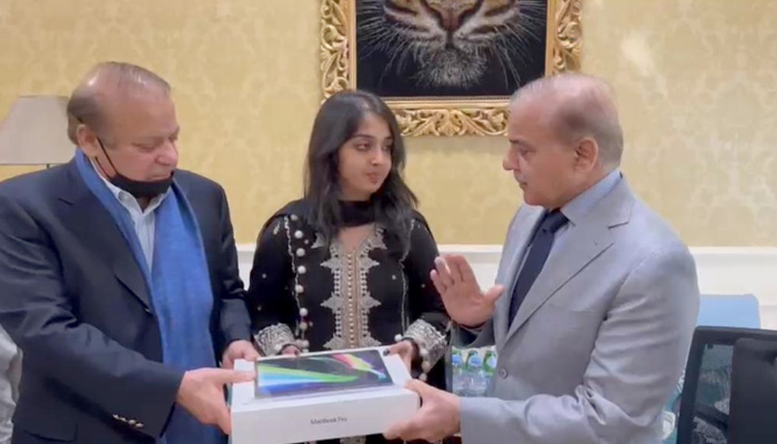 PML-N leaders Nawaz Sharif and Shehbaz Sharif present laptop to Mahnoor Cheema. — by reporter