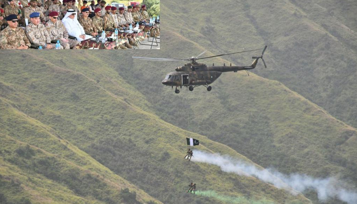 This image released on September 4, 2023, shows a helicopter taking joint forces of Pakistan and Saudi Arabia during military drills AL BATTAR-I at Cherat while on the top left, officials are witnessing the exercise. — ISPR website