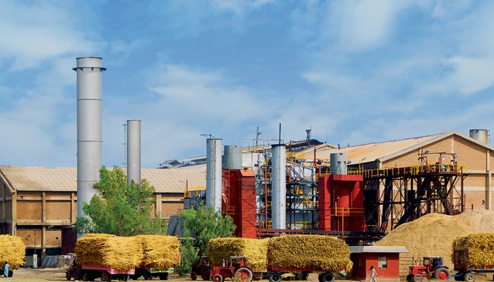 In this image, Sheikhoo Sugar Mills can be seen with its trucks loaded with sugar cane. — Sheikhoo Sugar Mills website