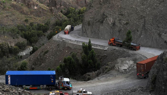 Heavy transport vehicles while en route to their destination on the border area of Iran and Pakistan. — AFP/File