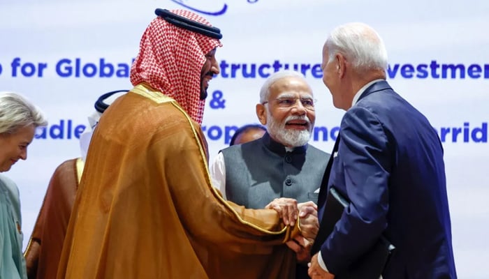India’s PM Narendra Modi (2R), US President Joe Biden (R), Saudi Arabia’s Crown Prince Mohammed bin Salman hold hands before the start of a session at the G20 summit in New Delhi on September 9, 2023. — AFP