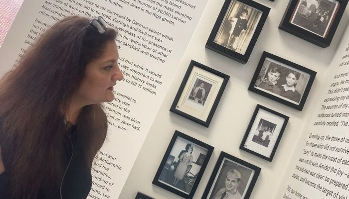 Dr Afridi looks on at the photo and text display at the Holocaust Museum in New Yorks Manhattan College. — Photo by author