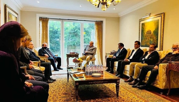 This picture uploaded on May 11, 2022, shows PMLN leaders with former PM Shehbaz (C) and brother Nawaz Sharif (Center-left) attending a meeting in the UK. — X/ZartajGulWazir
