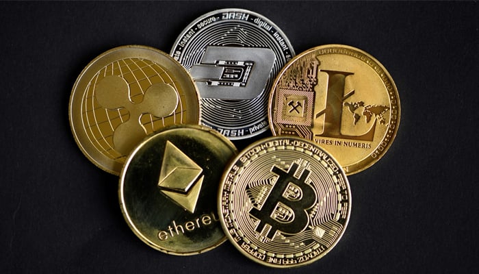 A number of cryptocurrencies can be seen in this representational image. — AFP/File