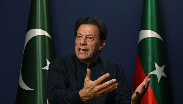 Former Pakistans Prime Minister Imran Khan gestures as he speaks during an interview with AFP at his residence in Lahore on May 18, 2023. AFP