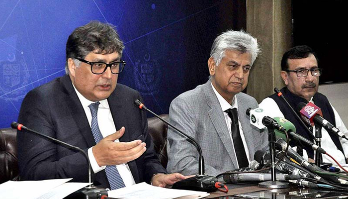 Caretaker Minister for Privatization Fawad Hassan Fawad (left) while addressing a press conference with Minister for Information and Broadcasting Murtaza Solangi on September 21, 2023. — APP