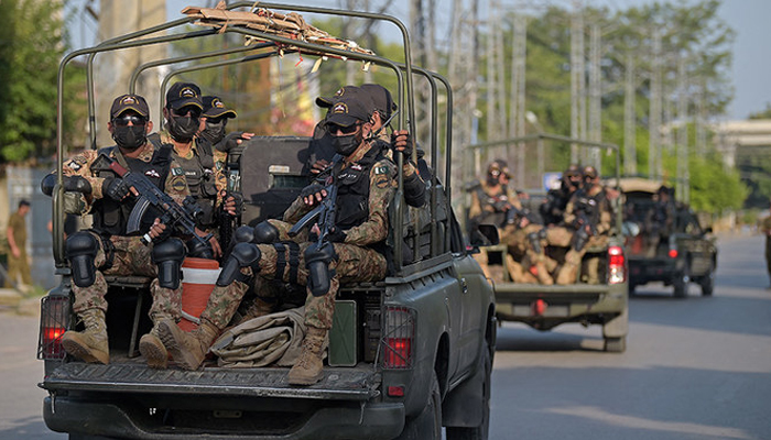 Pakistans army commandos depart in their vehicles after escorting a high-profile convoy in Rawalpindi on September 13, 2021. — AFP