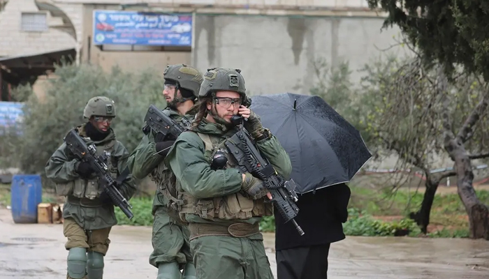 sraeli soldiers patrol Huwara in the occupied West Bank, on March 20, 2023. — AFP
