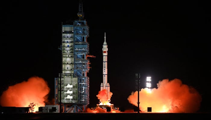 A Long March-2F rocket, carrying the Shenzhou-15 spacecraft with three astronauts to Chinas Tiangong space station, lifts off from the Jiuquan Satellite Launch Center in northwest China. — AFP