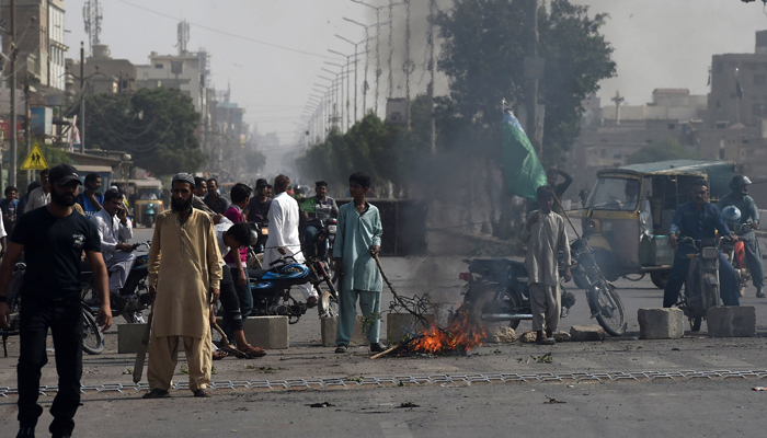 Tehreek-e-Labbaik Pakistan (TLP) supporters can be seen blocking the road and protesting in Faizabad. — AFP/File