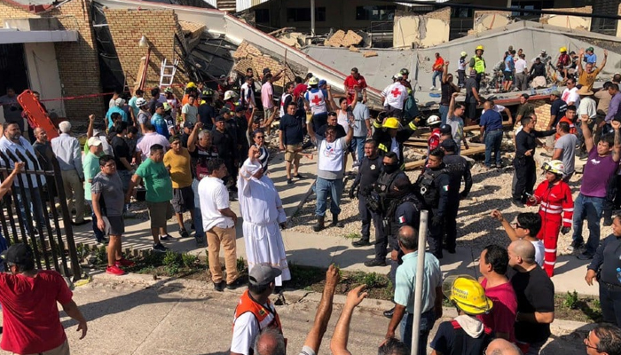 Rescuers and members of Civil Protection working to rescue people who were trapped after a church roof collapsed in Ciudad Madero, Tamaulipas State, Mexico on October 1, 2023. — AFP