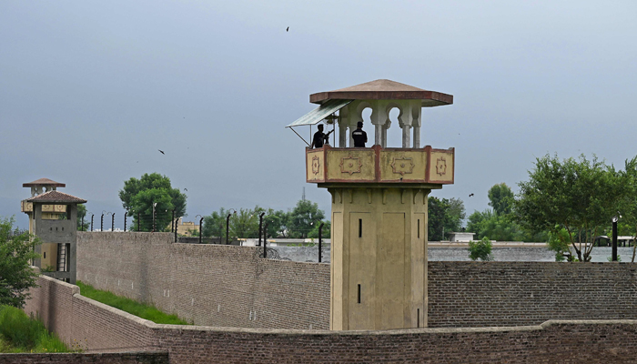 Policemen stand at a watch tower of the Attock jail, where former prime minister Imran Khan is being held. — AFP/File