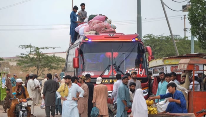 Afghan refugees board a bus from Karachi, Pakistan, to Afghanistan on Sept. 21, 2023. — AFP