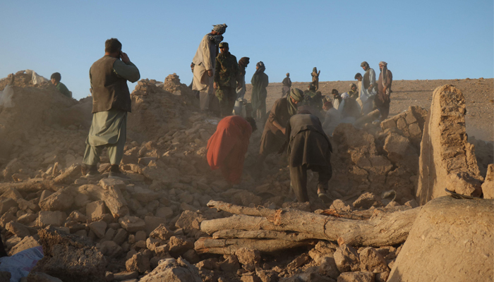 Afghan residents clear debris from a damaged house after an earthquake in Sarbuland village of Zendeh Jan district of Herat province on October 7, 2023.  — AFP