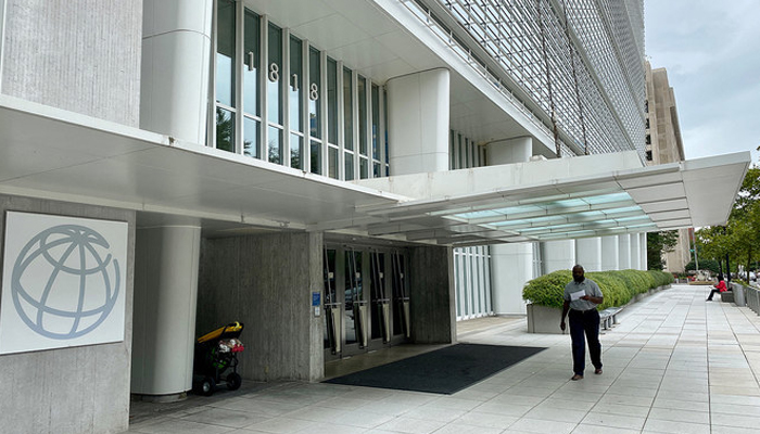 A man is walking in front of the World Bank Building in Washington DC on September 25, 2020. — AFP