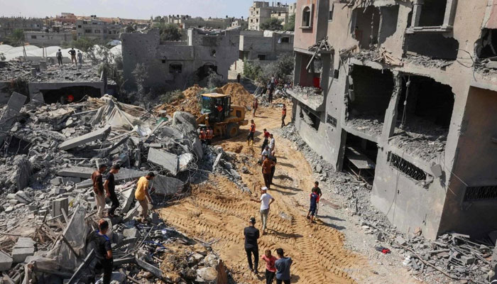 Palestinians search for victims under rubble after Israeli strikes on Rafah in southern Gaza. — AFP/File