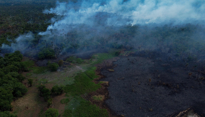 Aerial view of a fire in the Amazon rainforest in Iranduba, Amazonas, northern Brazil, on September 23, 2023. — AFP