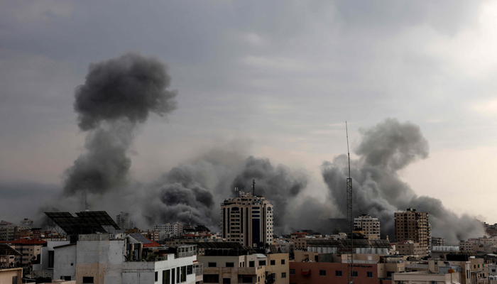 A plume of smoke rises in the sky of Gaza City during an Israeli airstrike on October 9, 2023. — AFP