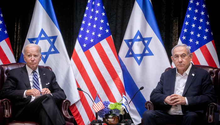 US President Joe Biden (L), sits with Israeli Prime Minister Benjamin Netanyahu, at the start of the Israeli war cabinet meeting, in Tel Aviv on October 18, 2023. — AFP