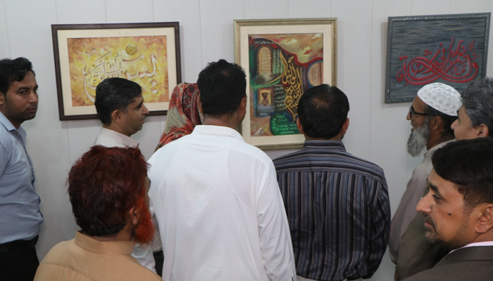 People look an Islamic Calligraphy during an exhibition of Islamic Calligraphy at the Punjab Arts Council (PAC). — PAC website