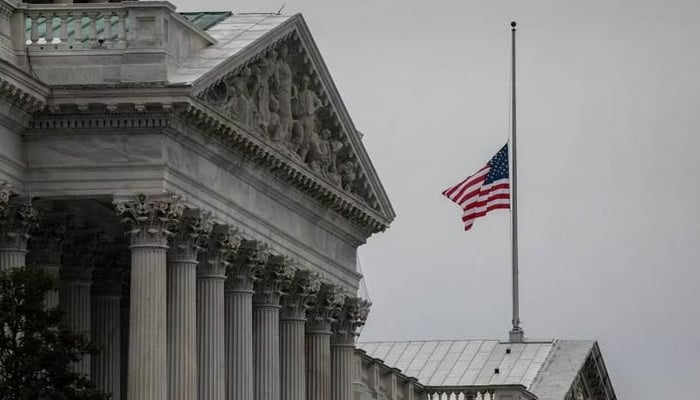 The American flag flies at half-staff at the US Capitol. — AFP/File