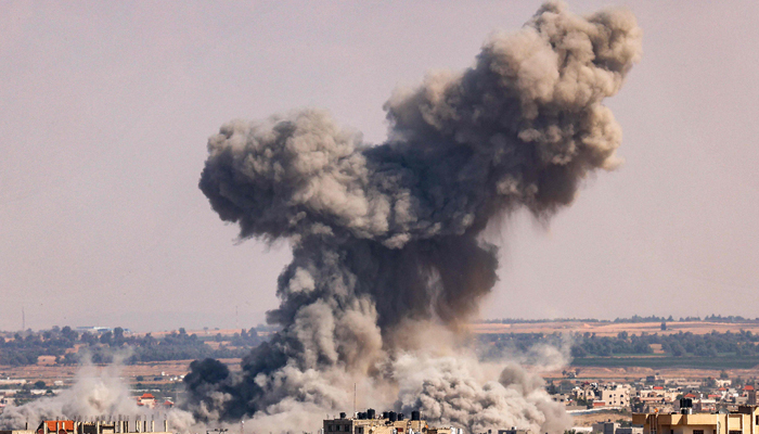 A smoke plume erupts during Israeli bombardment in Rafah in the southern Gaza Strip on October 19, 2023. — AFP