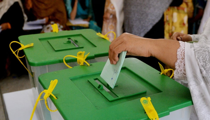 A person can be seen casting a vote in Pakistan. — AFP/File