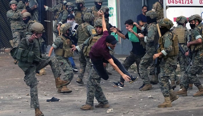 Lebanese army soldiers scuffle with protesters during a pro-Palestine demonstration near the US embassy in Aukar, a northern suburb of Beirut, Lebanon, on Wednesday. South China Morning Post