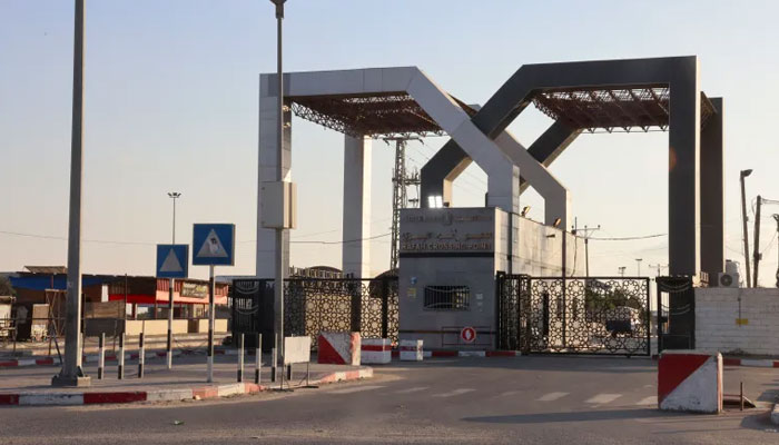 A picture taken on October 10, 2023, shows the closed gates of the Rafah border crossing from Gaza to Egypt after repeated Israeli air attacks. AFP/File