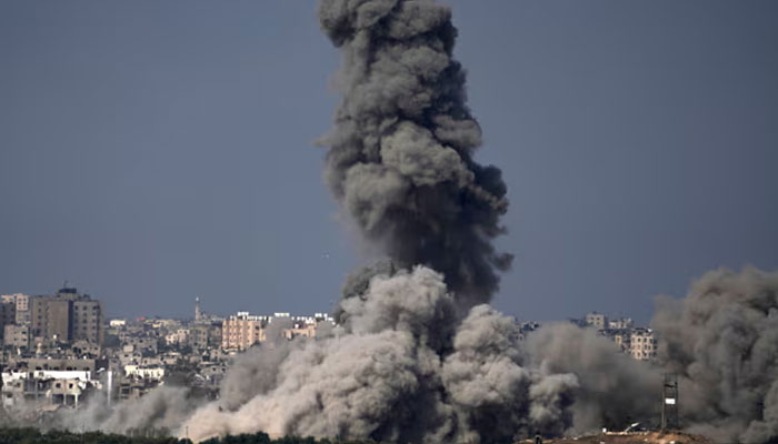 Smoke rises after an Israeli airstrike in the Gaza Strip. The Guardian