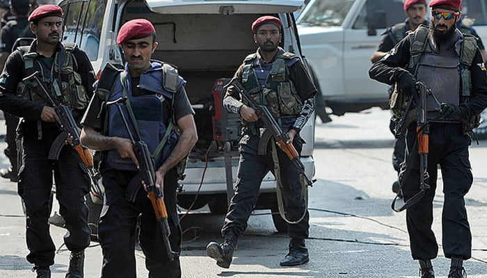 Police commandos can be seen standing guard. — AFP/File