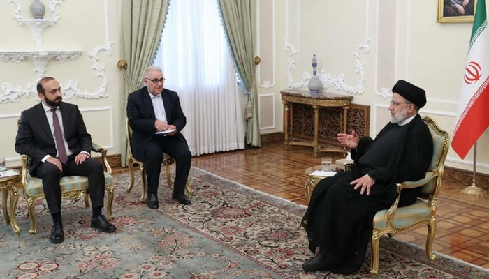 A handout picture provided by Irans Presidency shows Iranian President Ebrahim Raisi (R) meeting with Armenian Foreign Minister Ararat Mirzoyan (L) in Tehran on October 23, 2023. (AFP)