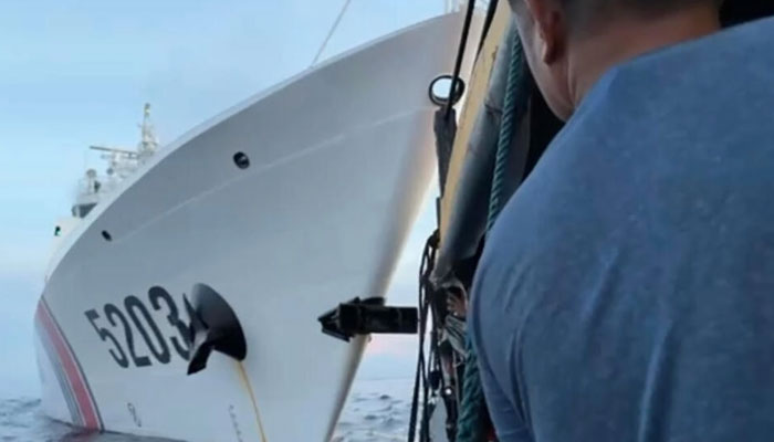 This videograb by the Armed Forces of the Philippines shows a collision between a Chinese Coast Guard ship (L) and Philippines resupply boat (R) near the Second Thomas Shoal, in the disputed South China Sea. AFP