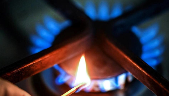 A representational image shows a stove being flamed up by a person using a match stick. — AFP/File