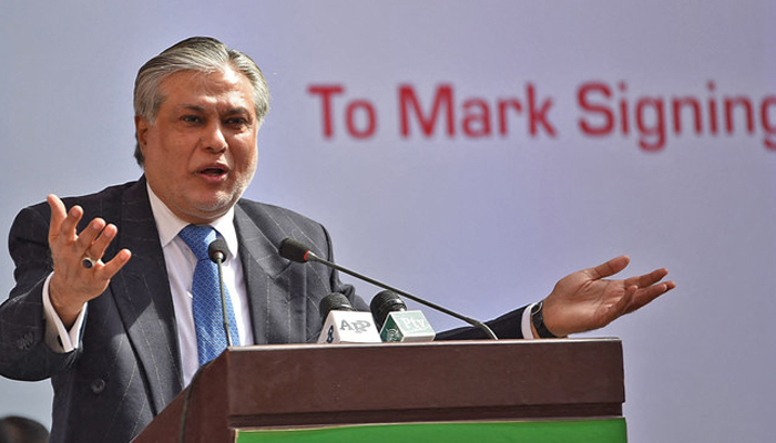 The then-Finance minister Ishaq Dar speaking with the people in a public gathering. — AFP/File
